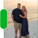 Happy couple embracing on beach at sunset during romantic portrait session