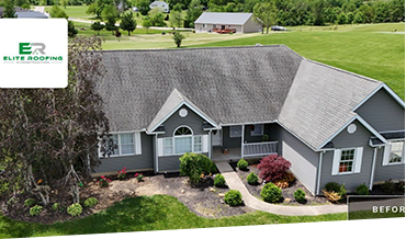 Aerial view of a suburban house with grey roof and landscaped yard.