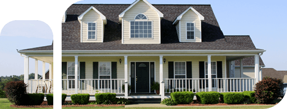 Charming two-story house with large porch and dormer windows.